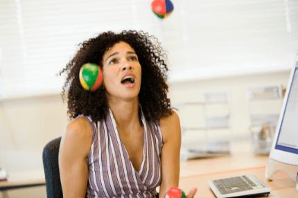 Woman juggling balls and emtionally stressed